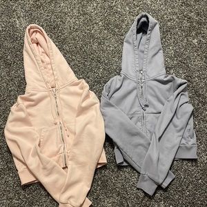 John galt/brandy Melville cropped pink and purple zip up hoodies!